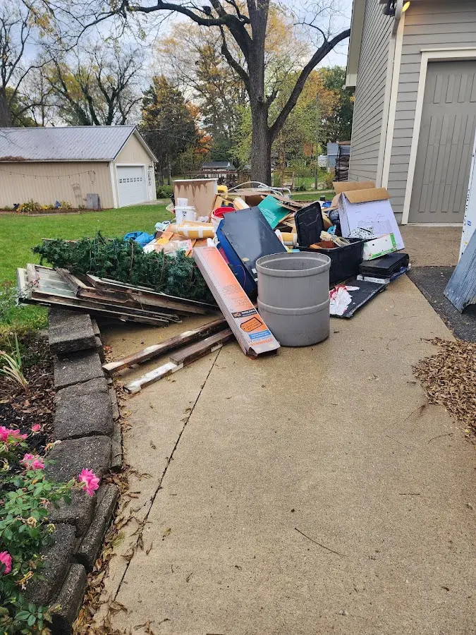 Dumpster being loaded with debris for Residential Dumpster Rental in Broadmoor